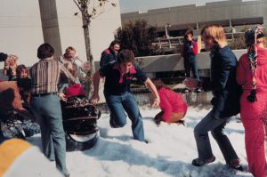 Staff and students having fun in the snow on campus in the 1970s.