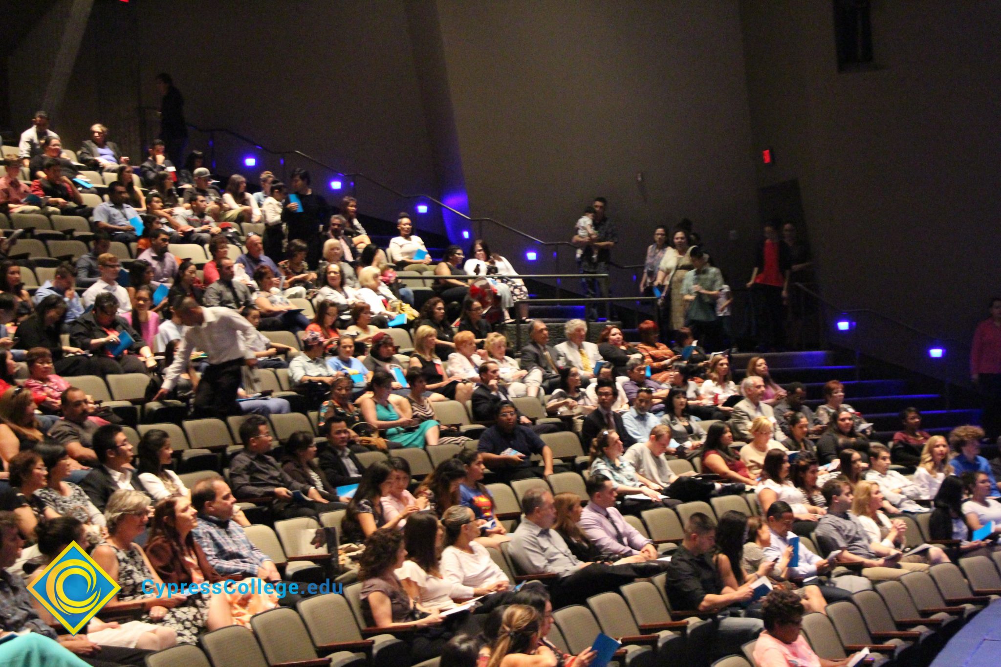 People seated in the campus theater.