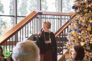 Dr. JoAnna Schilling laughing at the Holiday Celebration.