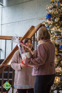 Raffle basket prize winner getting her basket.