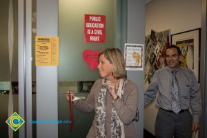 Language Arts Dean Eldon Young receives Mardi Gras beads