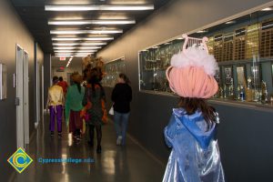 Employees and students dressed up for and participating in Mardi Gras parade