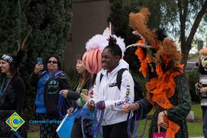 Employees and students dressed up for Mardi Gras parade