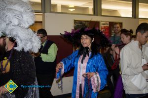 Employees and students dressed up for Mardi Gras parade