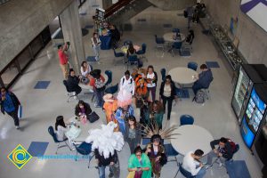 Employees and students dressed up for and participating in Mardi Gras parade in the SEM building