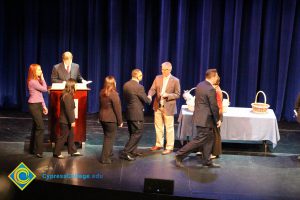 A group of men and women on stage at the 2014 Scholarship Awards Ceremony.