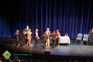 A group of men and women on stage at the 2014 Scholarship Awards Ceremony.