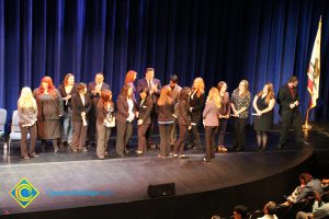 A group of men and women on stage at the 2014 Scholarship Awards Ceremony.