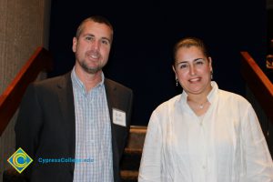 Professor Keith Vescial with a woman in a white blouse.