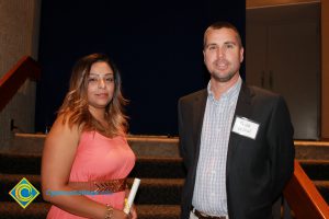 Professor Keith Vescial with a young lady in a peach dress.