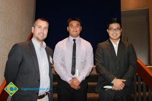 Professor Keith Vescial with two young men.