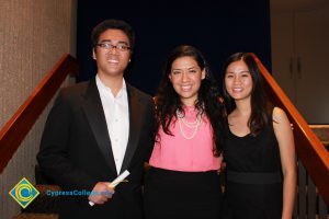 Yanet Garcia with two scholarship recipients.