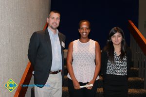 Professor Keith Vescial with a woman in a white blouse and a young lady in a black and white blouse and long black hair.