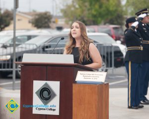 Young woman speaking at 2016 Veteran's Day Anniversary.