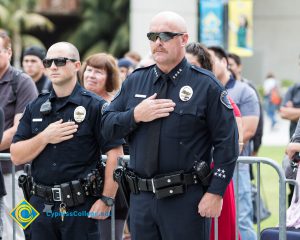 Two Cypress Police Officers with hand over heart.