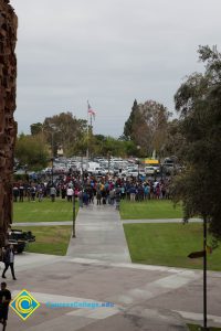 A crowd at the flagpole.