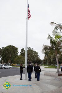 Lowering the flag.