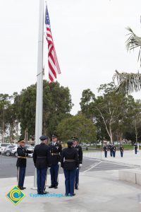 Lowering the flag.