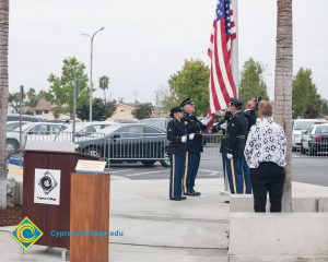 Lowering the flag.