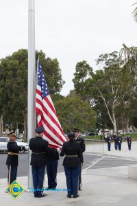 Lowering the flag.