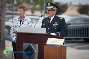 Man in military uniform speaking at 2016 Veteran's Day Anniversary,