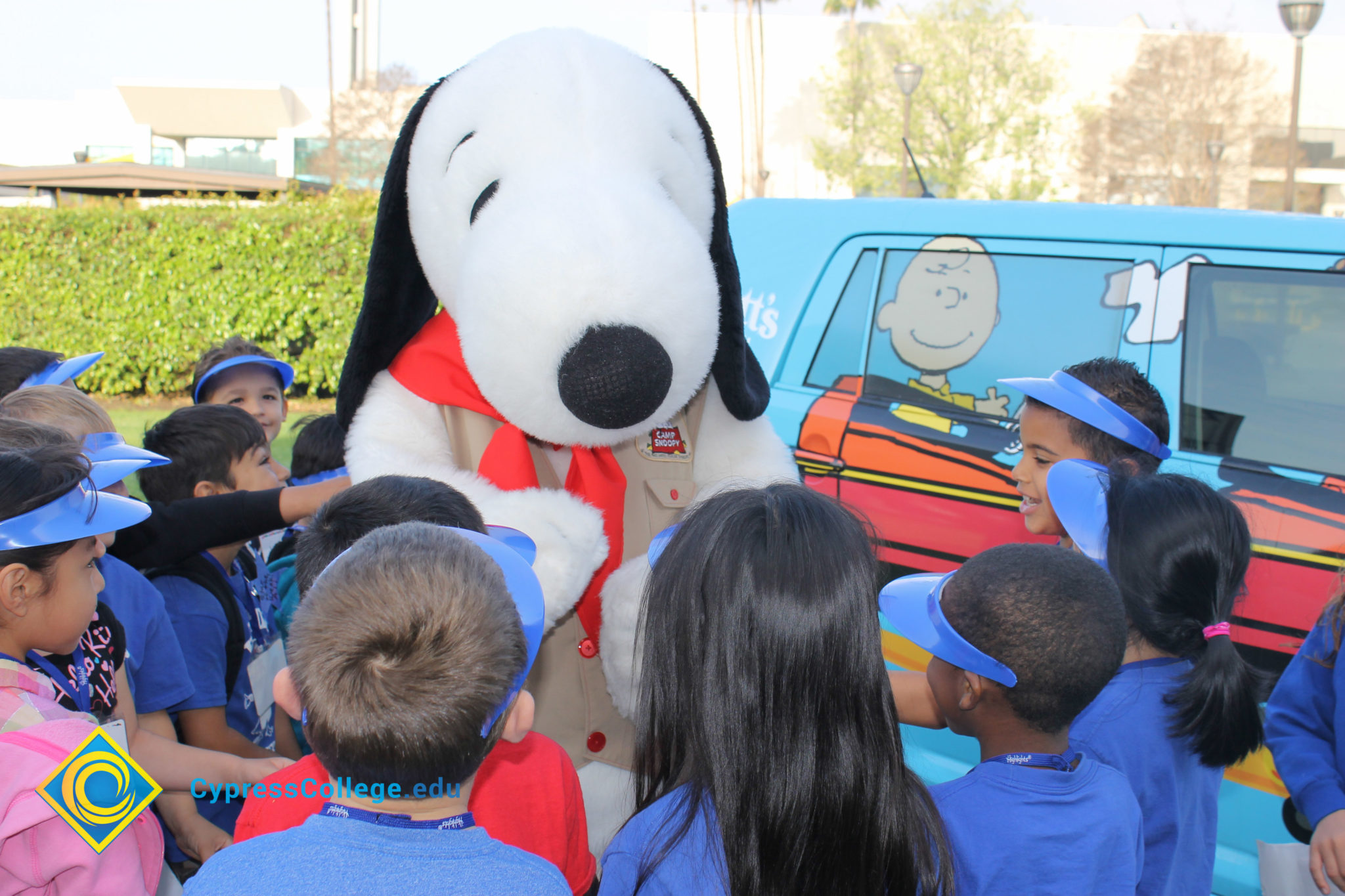 Snoopy with a group of young children.