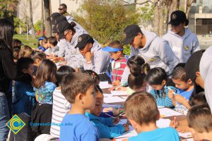 Children enjoying the activity table at the 2014 KinderCaminata,