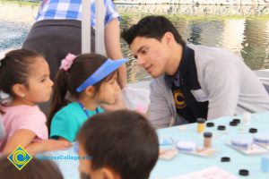 A young girl getting her face painted at the 2014 KinderCaminata.