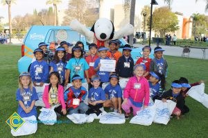 A group of kindergartners with Snoopy.