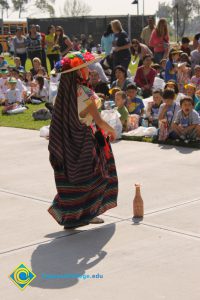 Young women performing a dance for the 2014 KinderCaminata.