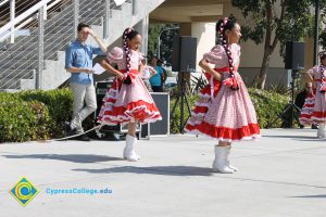 Young women performing a dance for the 2014 KinderCaminata.