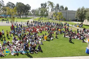 Children sitting on the lawn for 2014 KinderCaminata.