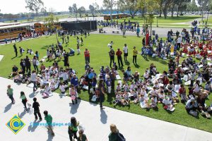 Children sitting on the lawn for 2014 KinderCaminata.