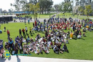 Children sitting on the lawn for 2014 KinderCaminata.