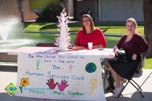 Students at the Human Services Club table.