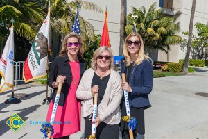 Three women holding shovels at the VRC Groundbreaking.