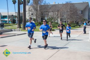 Participants running in the 3rd Annual Veteran's 5k on campus.