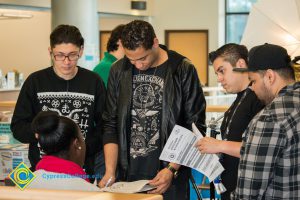 A group of students listening to a career advisor.