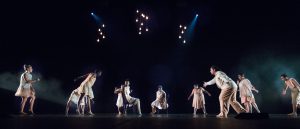 Dancers on stage wearing peach costumes