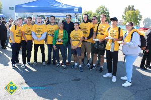 Group of Science, Engineering and Math students wearing yellow shirts.