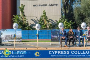 Staff seated for SEM Groundbreaking ceremony.