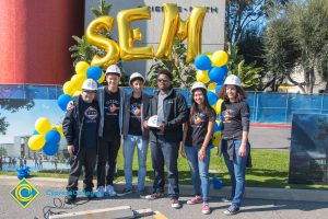 STEM² students wearing hard hats.