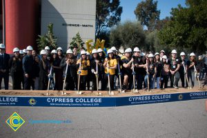 Group of people holding shovels at the SEM Groundbreaking event.