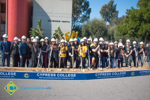 Group of people holding shovels at the SEM Groundbreaking event.