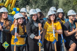 Group of people holding shovels at the SEM Groundbreaking event.