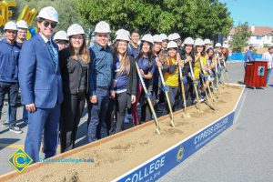 Group of people holding shovels at the SEM Groundbreaking event.