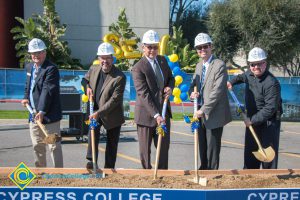 Group of people holding shovels at the SEM Groundbreaking event.