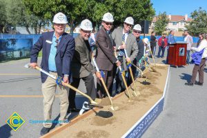 Group of people holding shovels at the SEM Groundbreaking event.