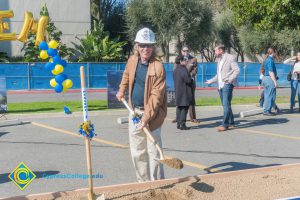 Staff shoveling dirt at the SEM Groundbreaking ceremony.