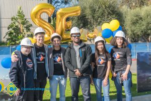 STEM² students wearing white hard hats